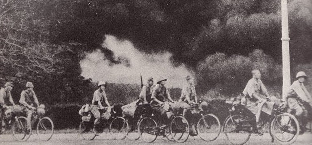 Japanese troops advancing on bicycles, Malaya